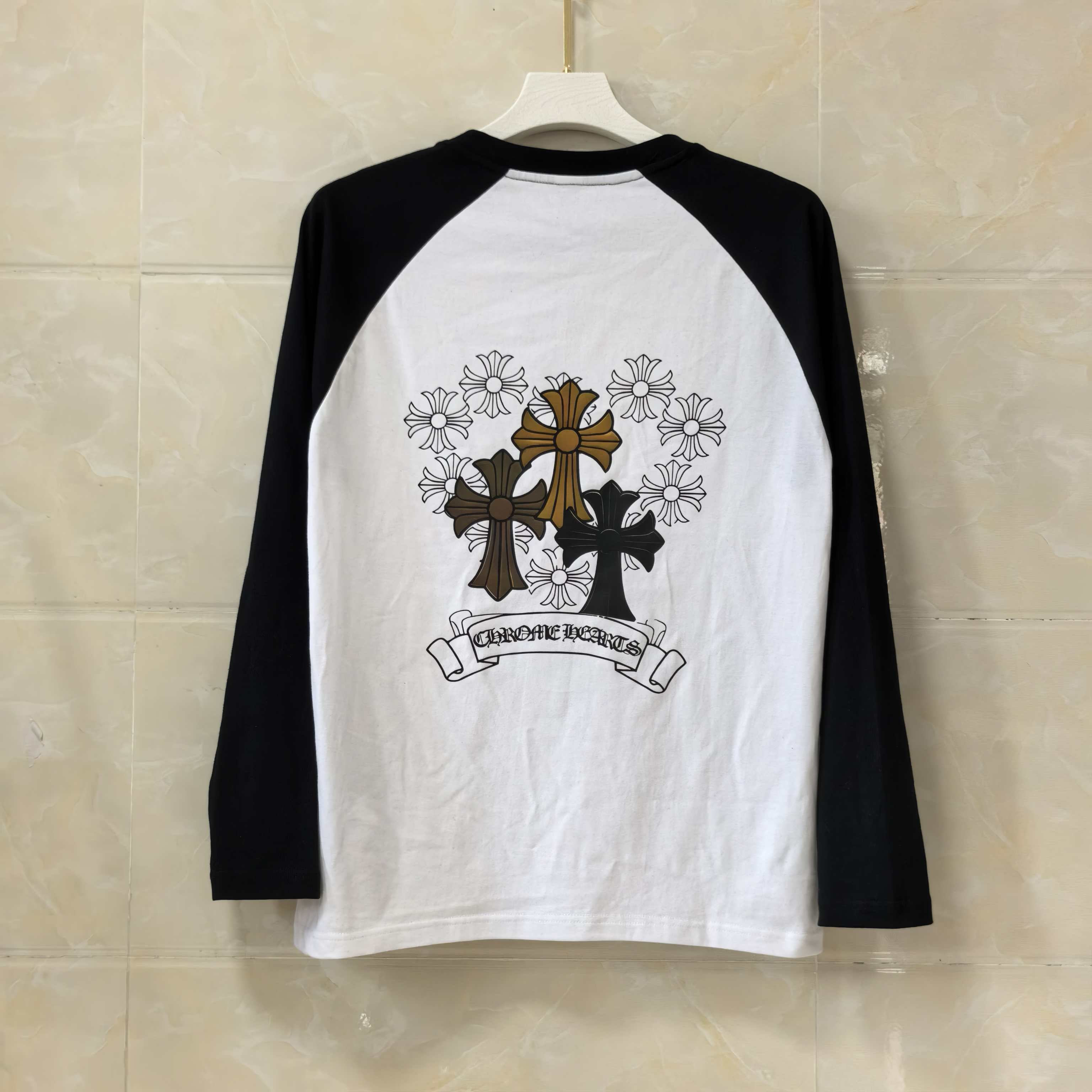 White raglan long-sleeve T-shirt with back cross and floral emblem print