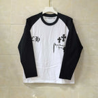 Raglan long-sleeve T-shirt, black sleeves and black accents, white body with gothic cross print
