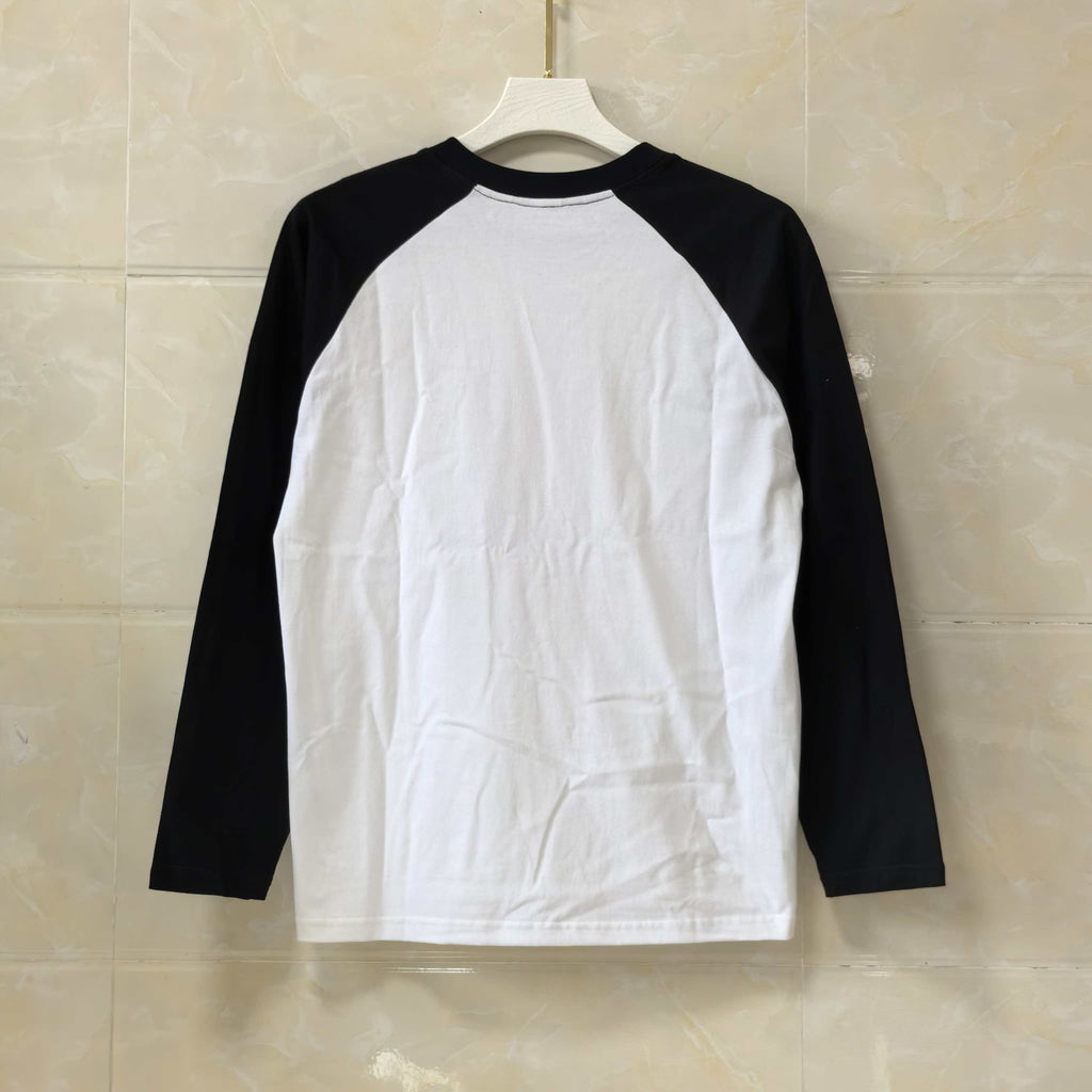Black and white long-sleeve raglan shirt with blank front and dark sleeves