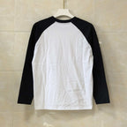 Black and white long-sleeve raglan shirt with blank front and dark sleeves