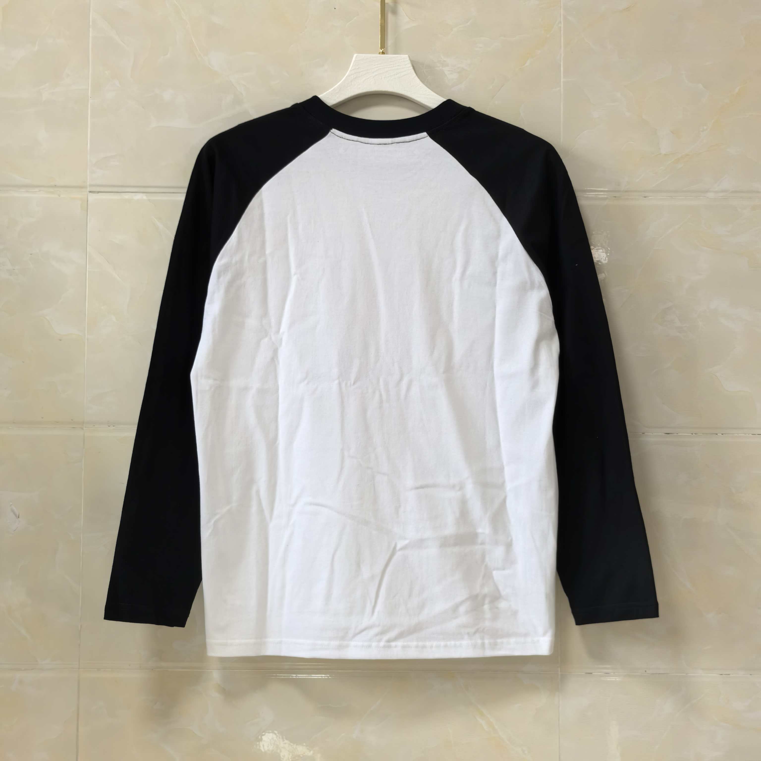 Long-sleeve raglan T-shirt, white front and back with black sleeves