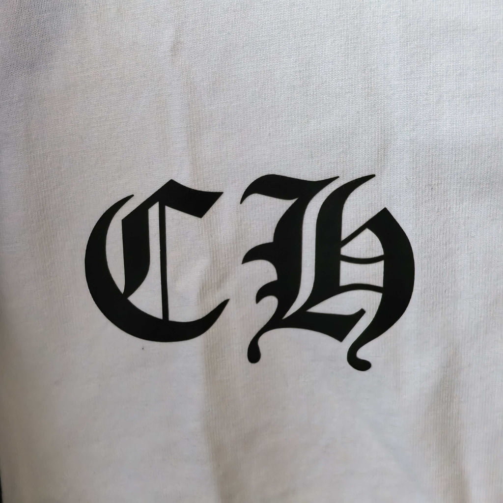 Close-up of white long-sleeve shirt sleeve with black gothic logo print