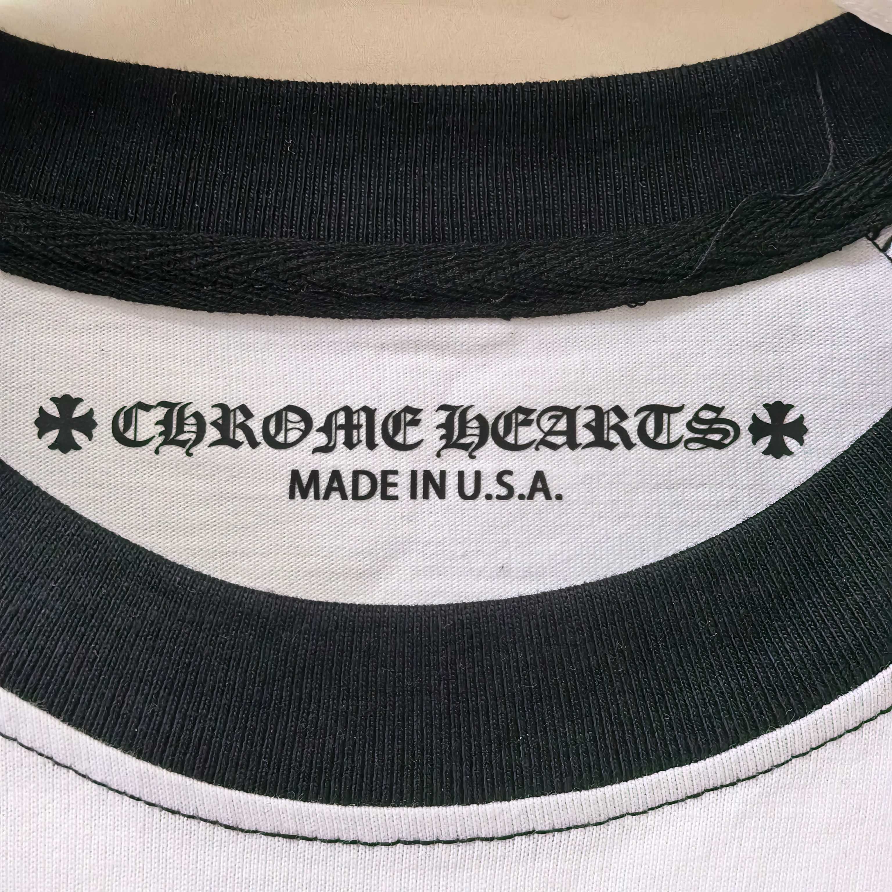 Neck label text reading Chrome Hearts and MADE IN U.S.A. on black collar