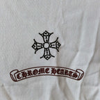 Long-sleeve T-shirt detail, crest and “Chrome Hearts” style emblem print on chest