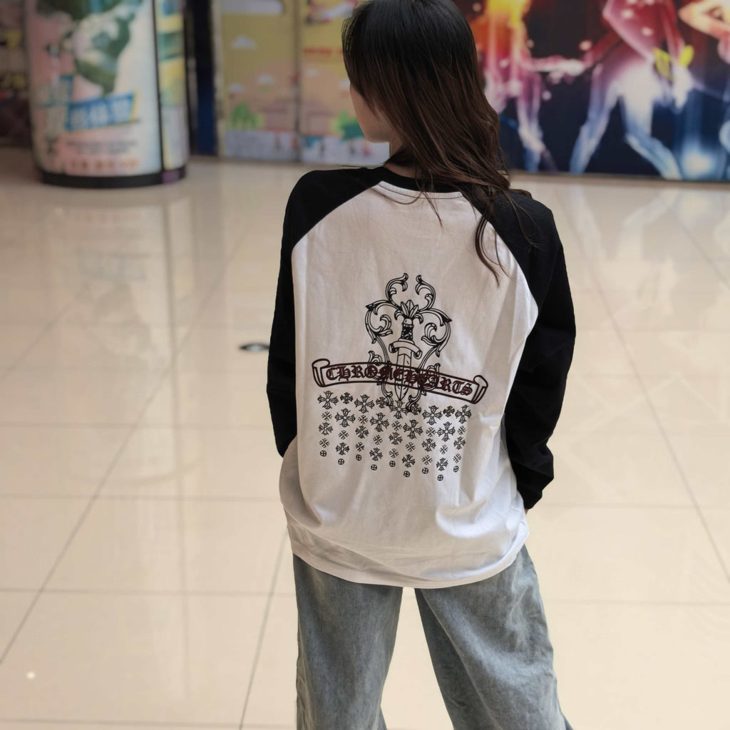 Raglan long-sleeve T-shirt on model, white body with black sleeves and back crest print