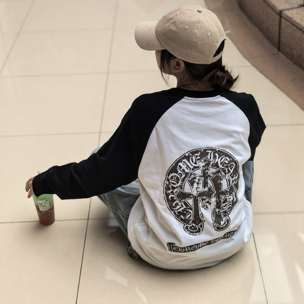 Long-sleeve raglan T-shirt with black sleeves and white back, large circular logo print