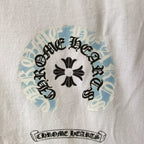 Close-up of round graphic and text print on white long-sleeve shirt