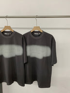Black short-sleeve T-shirt with crew neck and centered logo graphic