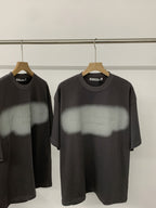 Black short-sleeve T-shirt with crew neck and faint logo graphic