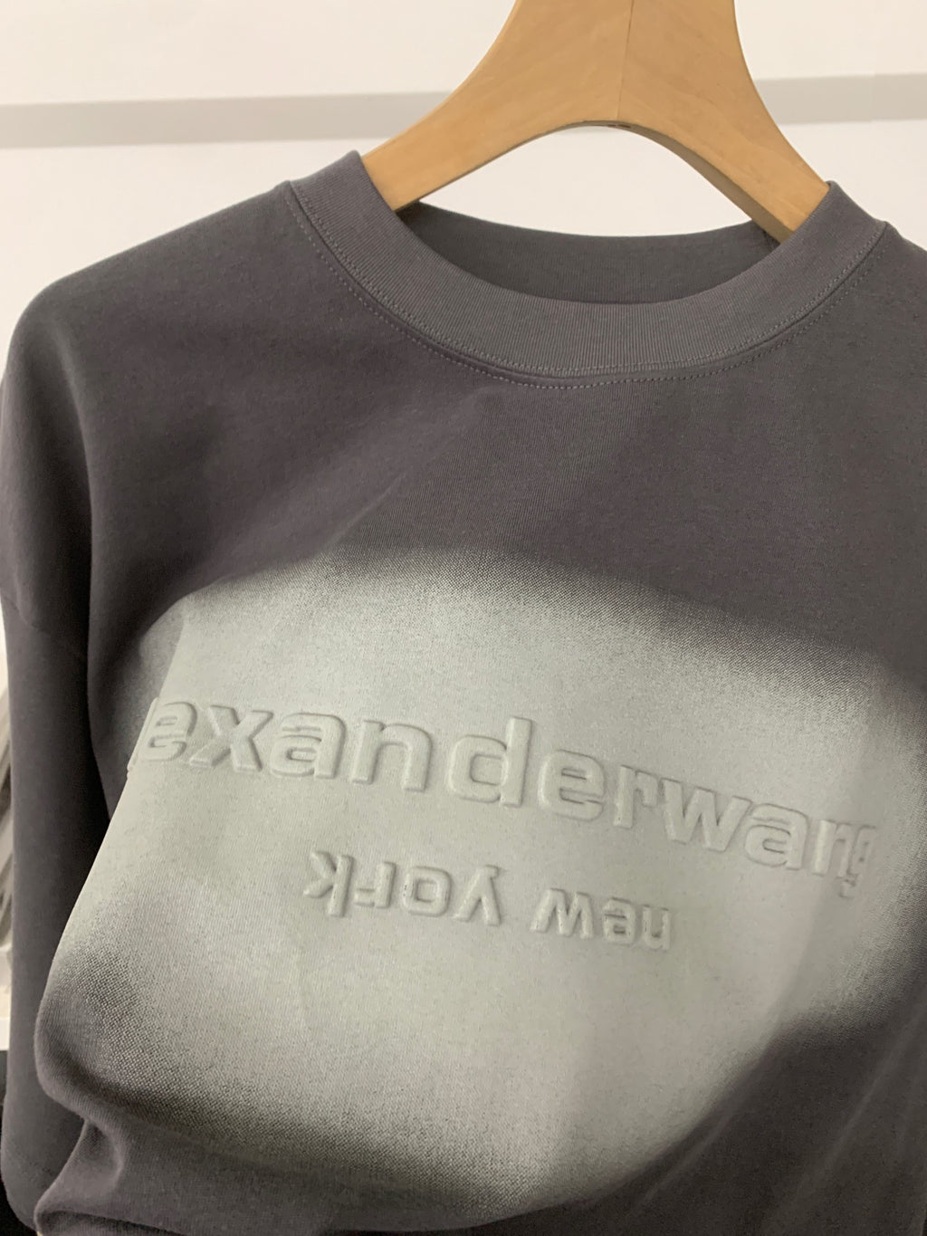 Black T-shirt with crew neck and large faded alexanderwang logo print