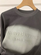 Black T-shirt with crew neck and large faded alexanderwang logo print