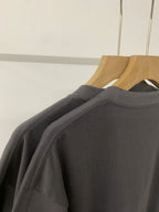 Black short-sleeve T-shirt shoulder seam and back panel