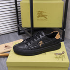 Black Burberry lace-up sneaker with tan collar trim and horse emblem on the side.