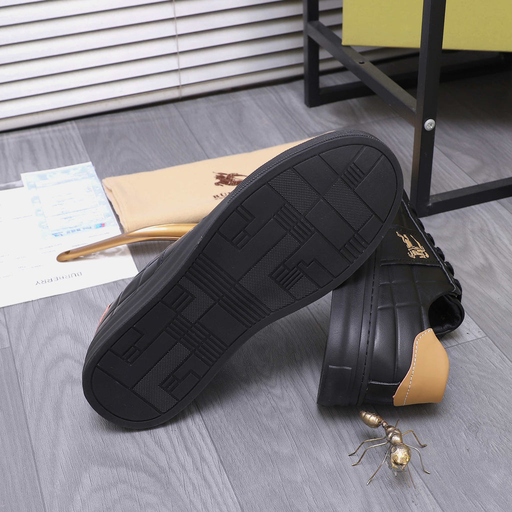 Black Burberry sneakers showing textured sole, tan heel tabs, and side horse emblem.
