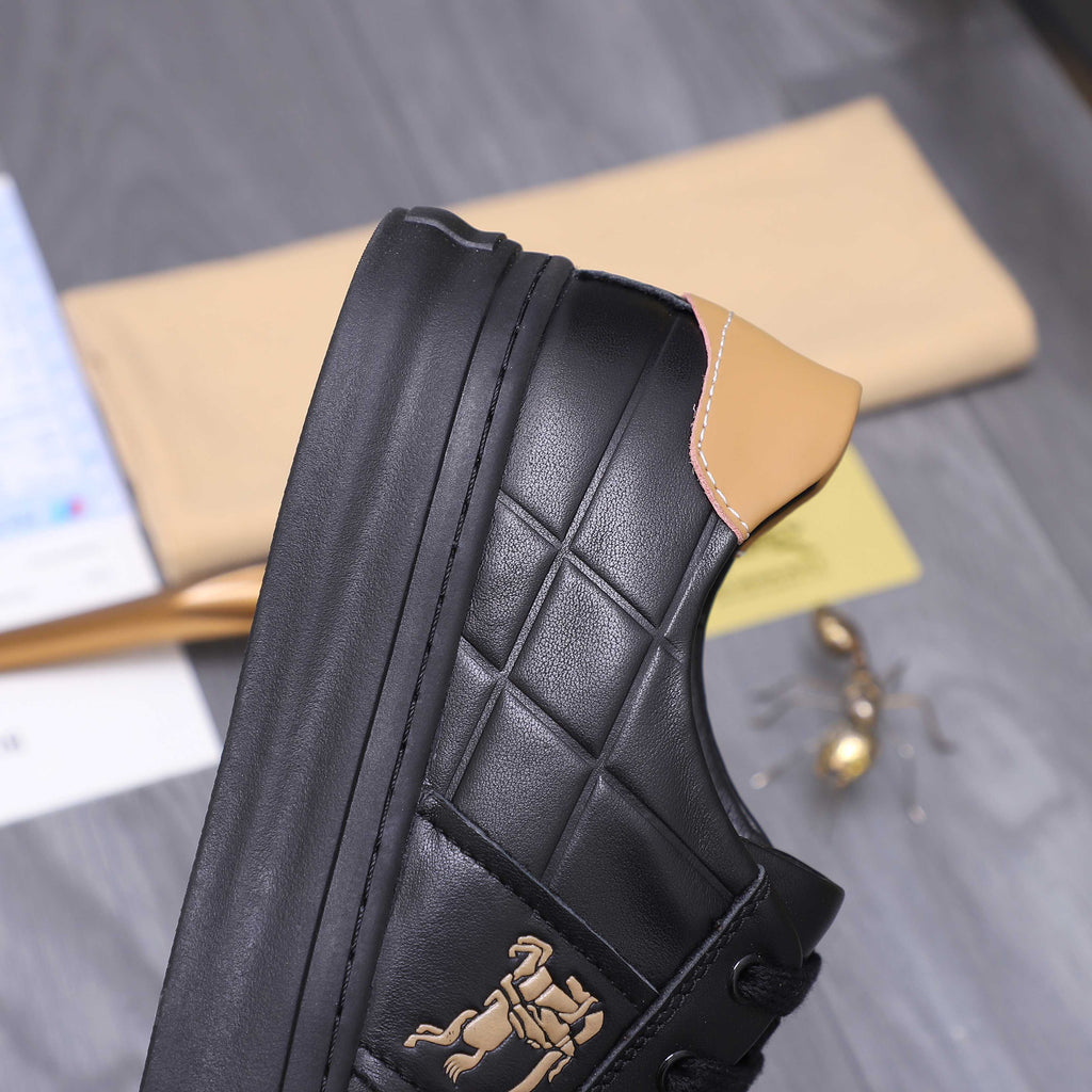 Black Burberry sneaker side view with quilted leather, tan collar, and horse emblem.