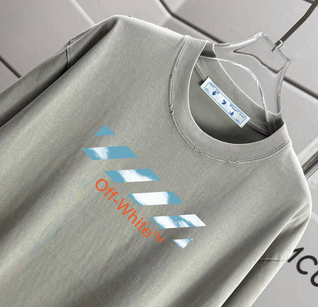 Off-White logo T-shirt close-up at neckline and front print on light gray fabric