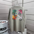Off-White graphic T-shirt in light gray with multicolor symbol print on front