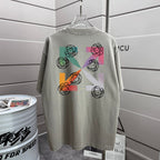Off-White graphic T-shirt in light gray with multicolor symbol print on front