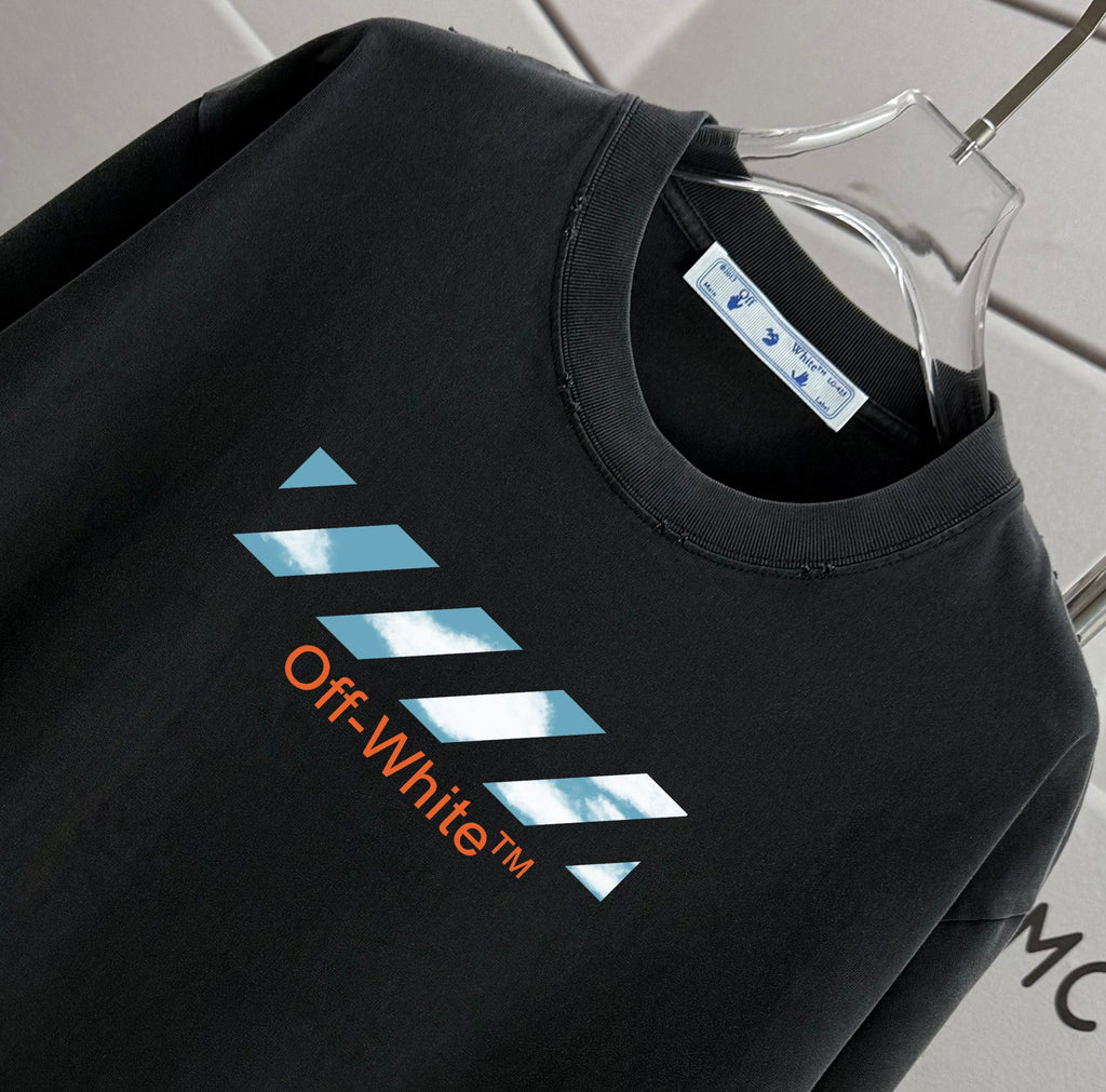 Off-White T-shirt close-up of black crew neck and blue "Off-White" graphic