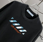 Off-White T-shirt close-up of black crew neck and blue "Off-White" graphic