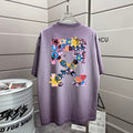 Off White lavender T-shirt with large multicolor back graphic, short sleeves, crew neck