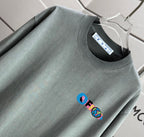 Dark gray crew-neck T-shirt with short sleeves and small chest graphic detail