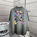 Short-sleeve T-shirt in dark gray with colorful graphic print on the back