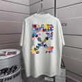 Off-white T-shirt with colorful graphic print on back