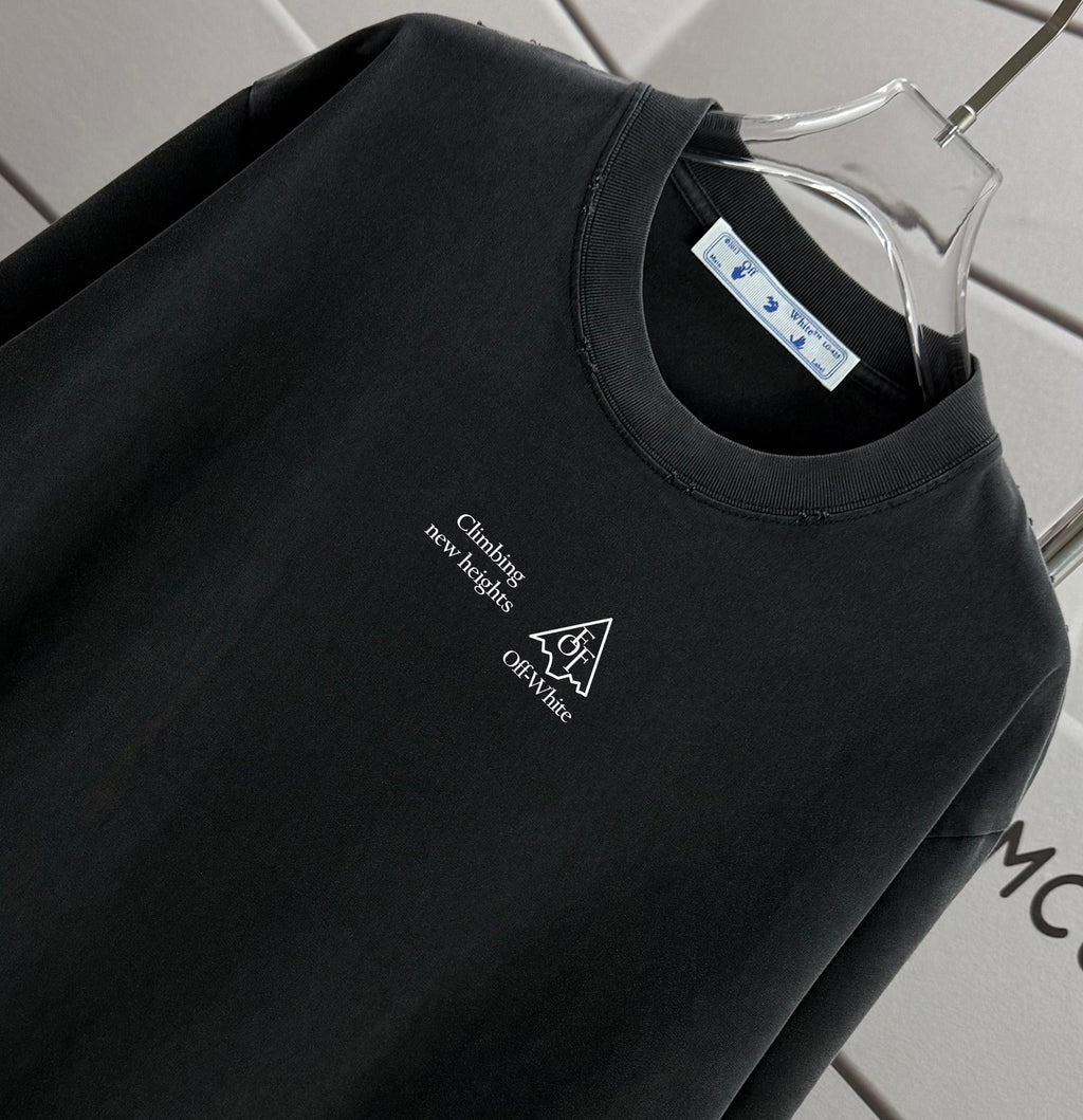 Black T-shirt neckline with small chest text and icon