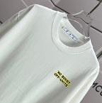 Off-white T-shirt close-up of round collar and small yellow chest text