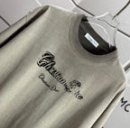 Gray short-sleeve T-shirt close-up of front logo graphic