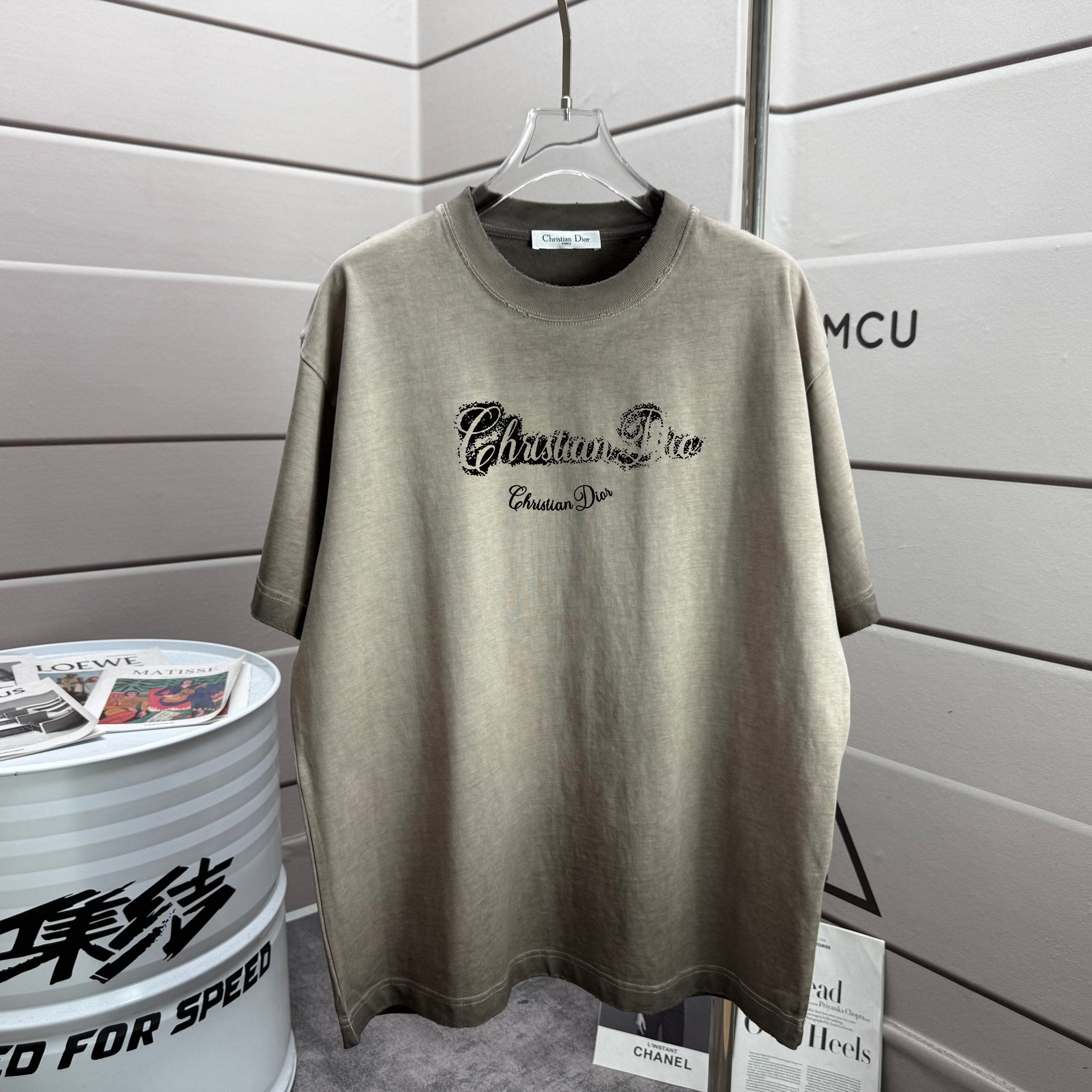 Gray short-sleeve T-shirt with black script logo on front