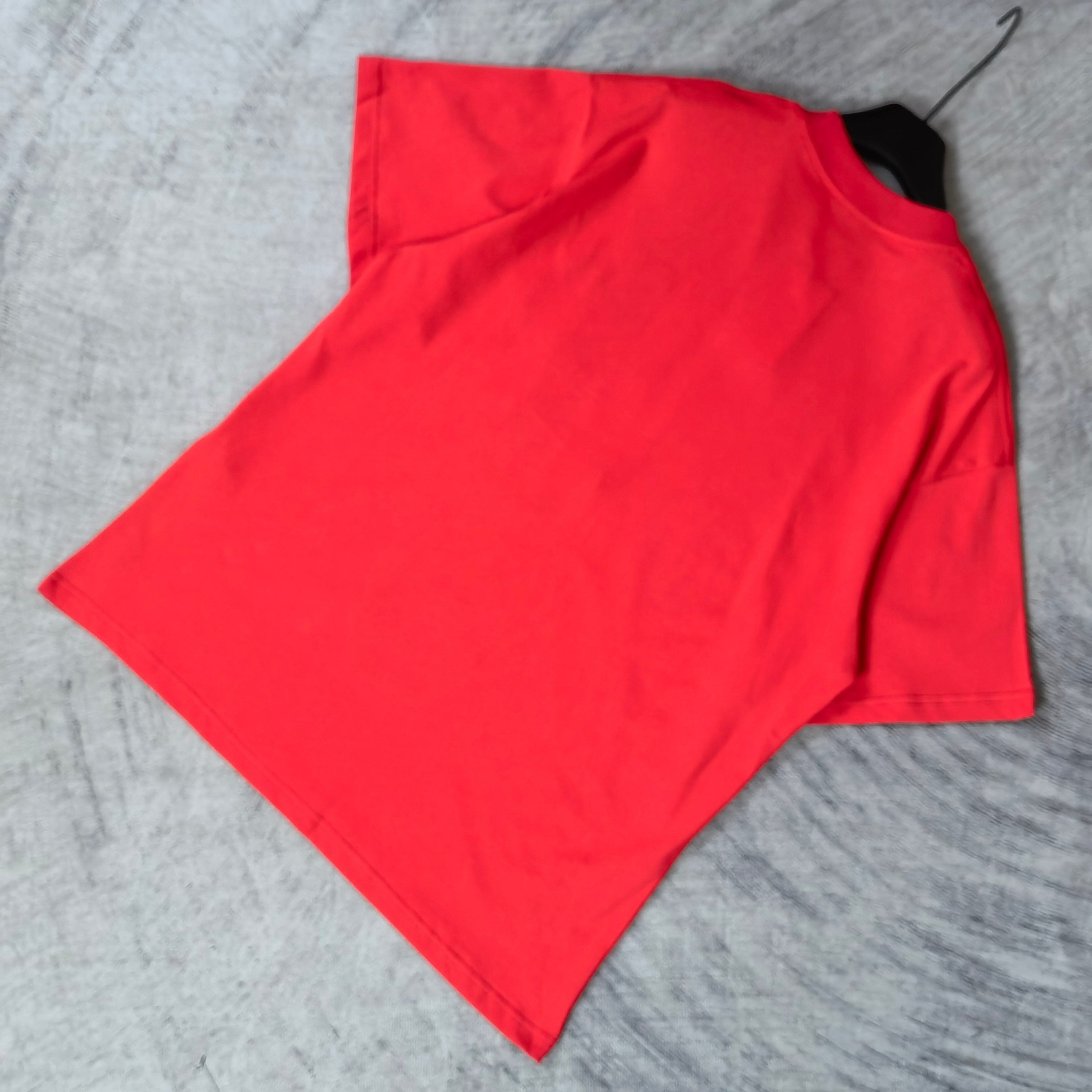 Balenciaga red short-sleeve T-shirt laid flat, no visible graphic