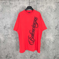 Balenciaga red short-sleeve T-shirt with black script graphic on the front
