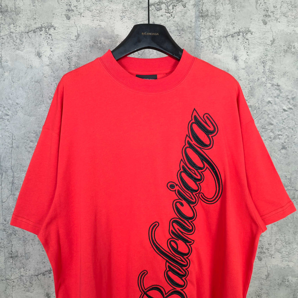 Balenciaga red short-sleeve T-shirt with black script logo on the front upper area