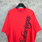 Balenciaga red short-sleeve T-shirt with black script logo on the front upper area