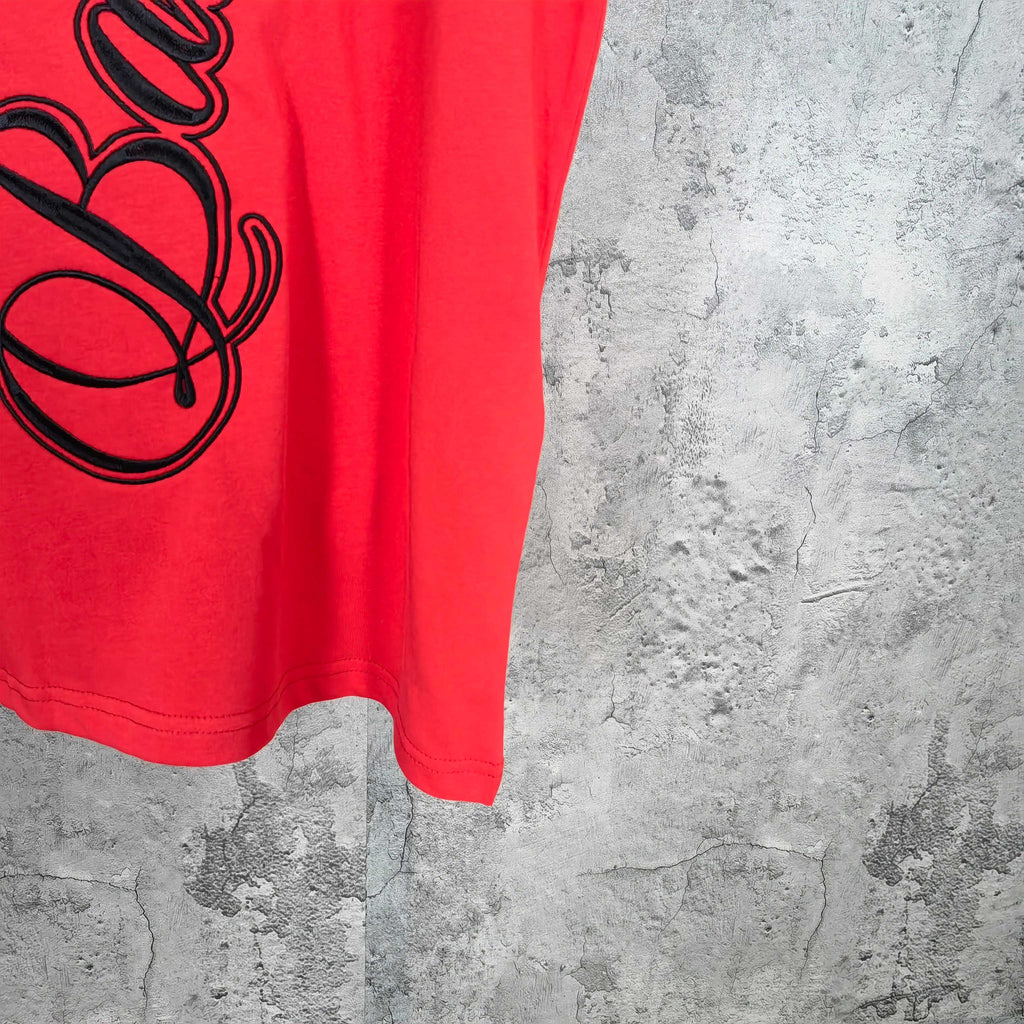 Balenciaga red short-sleeve T-shirt front hem with partial black script graphic