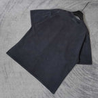 Dark wash T-shirt laid flat, crewneck and short sleeves visible