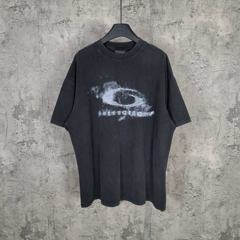 Graphic T-shirt with dark wash and white eye print at center chest