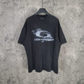 Graphic T-shirt with dark wash and white eye print at center chest