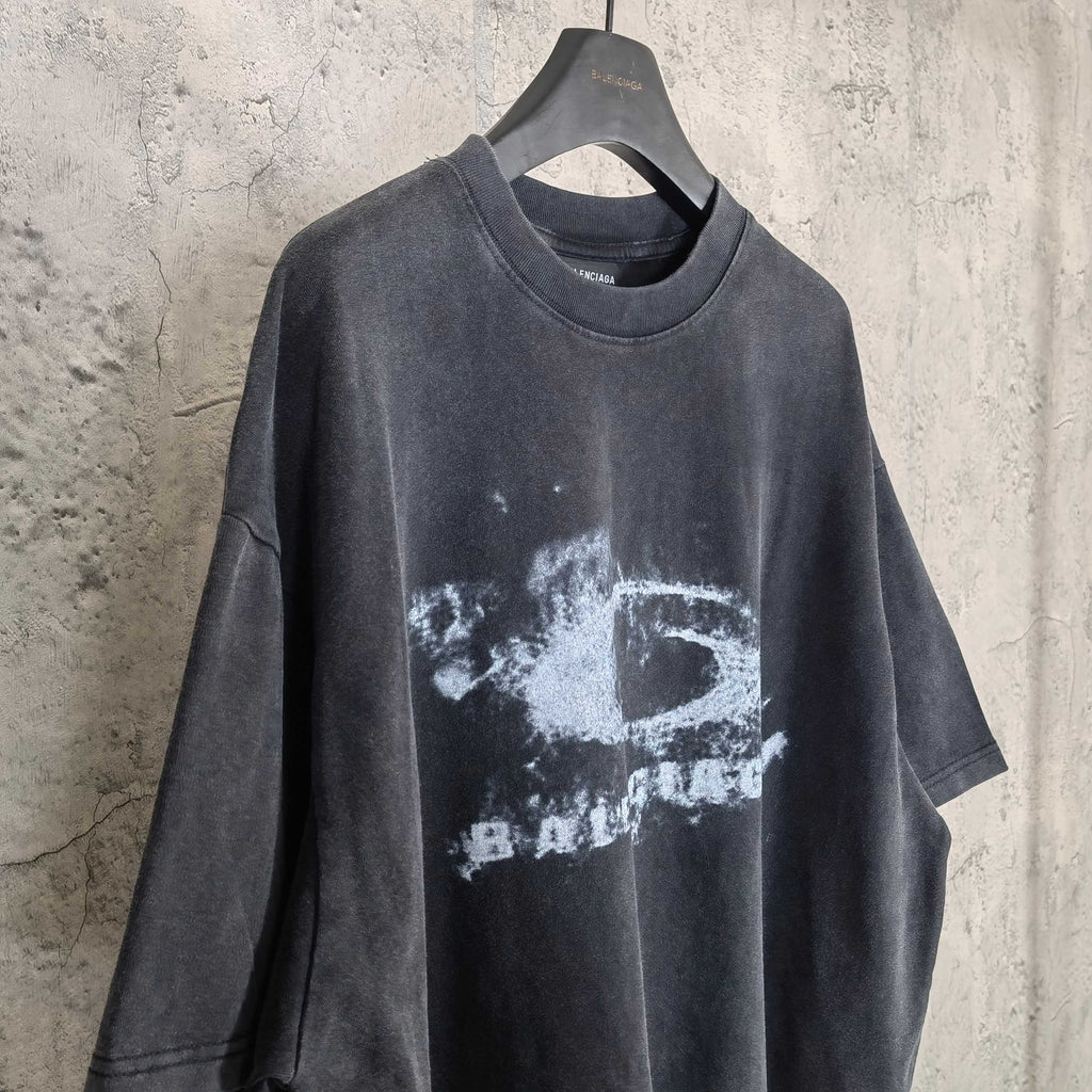 Dark wash T-shirt with white eye graphic and distressed Balenciaga-style lettering