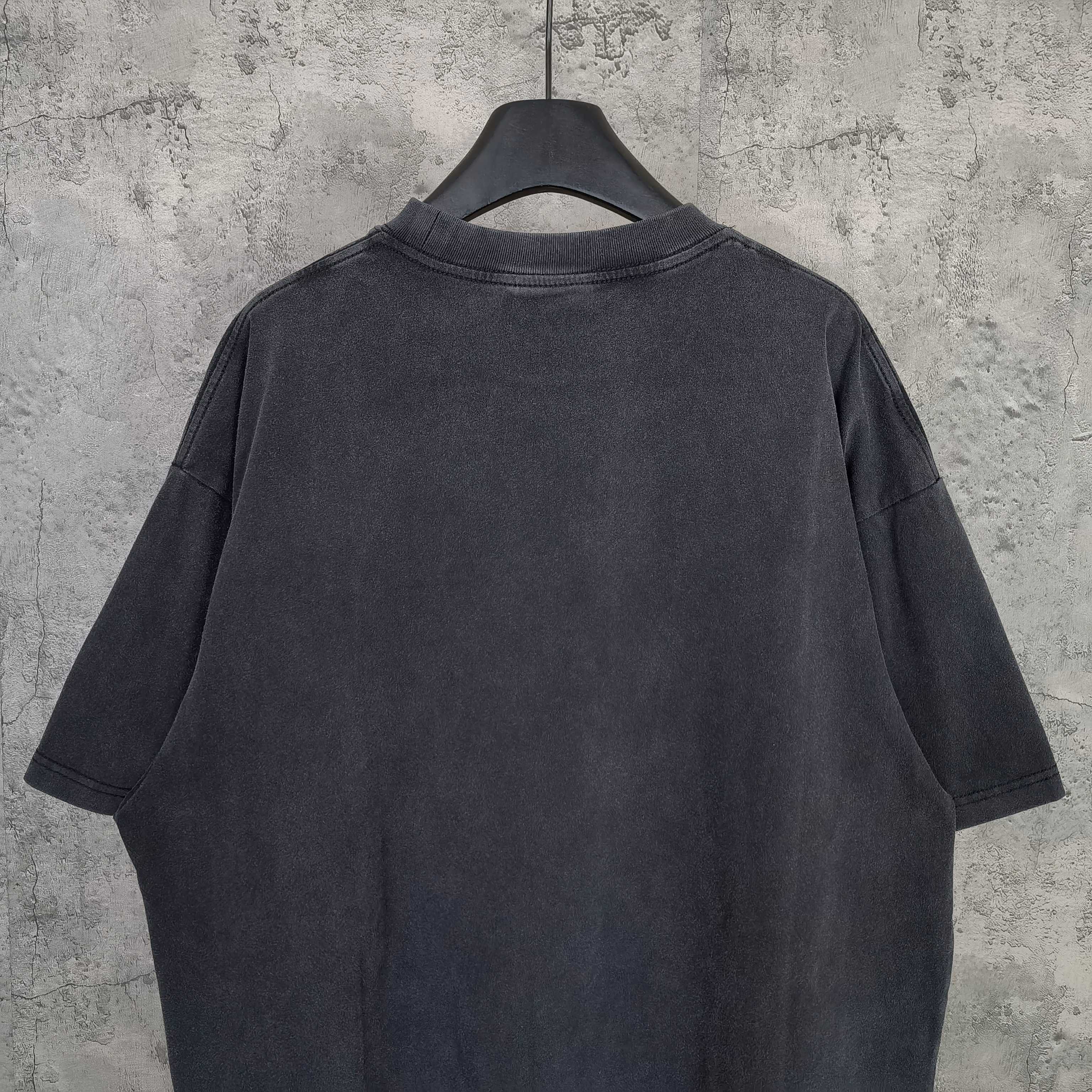 Dark wash crewneck T-shirt, back view with short sleeves and straight hem
