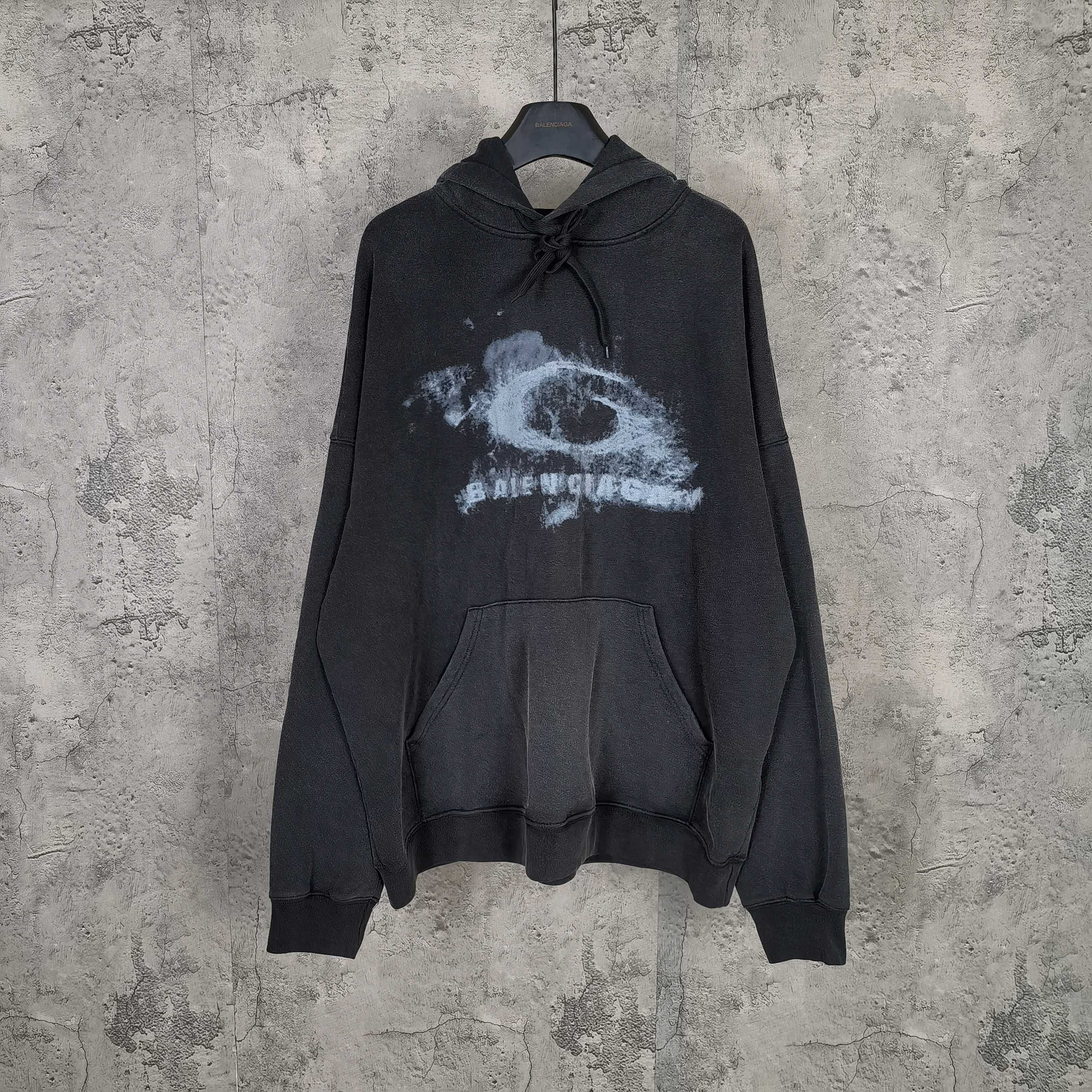 Balenciaga long-sleeve hoodie, dark with distressed logo print, hood, drawstring, pocket