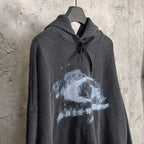 Balenciaga long-sleeve hoodie, dark with distressed logo print, hood tied with drawstrings