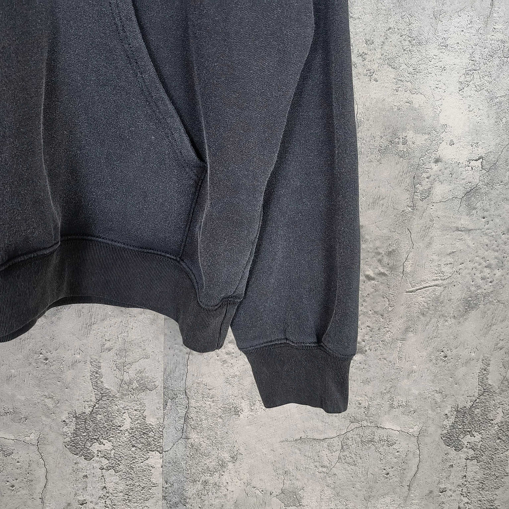 Balenciaga hoodie sleeve and hem detail in dark fabric with ribbed cuff