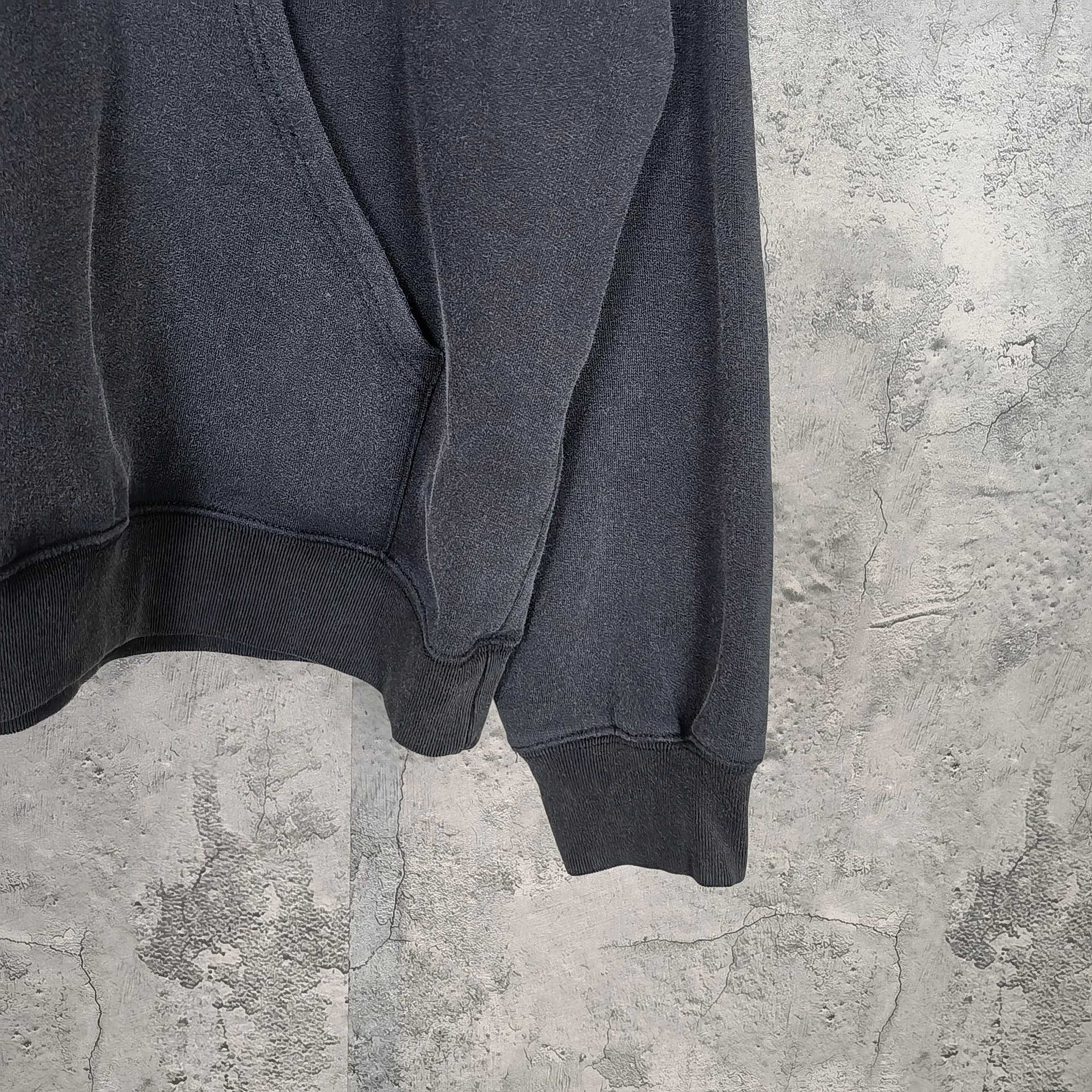 Balenciaga hoodie sleeve and hem detail in dark fabric with ribbed cuff