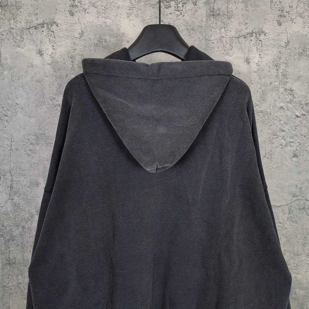 Balenciaga long-sleeve hoodie, dark back view with roomy hood and stitched seams