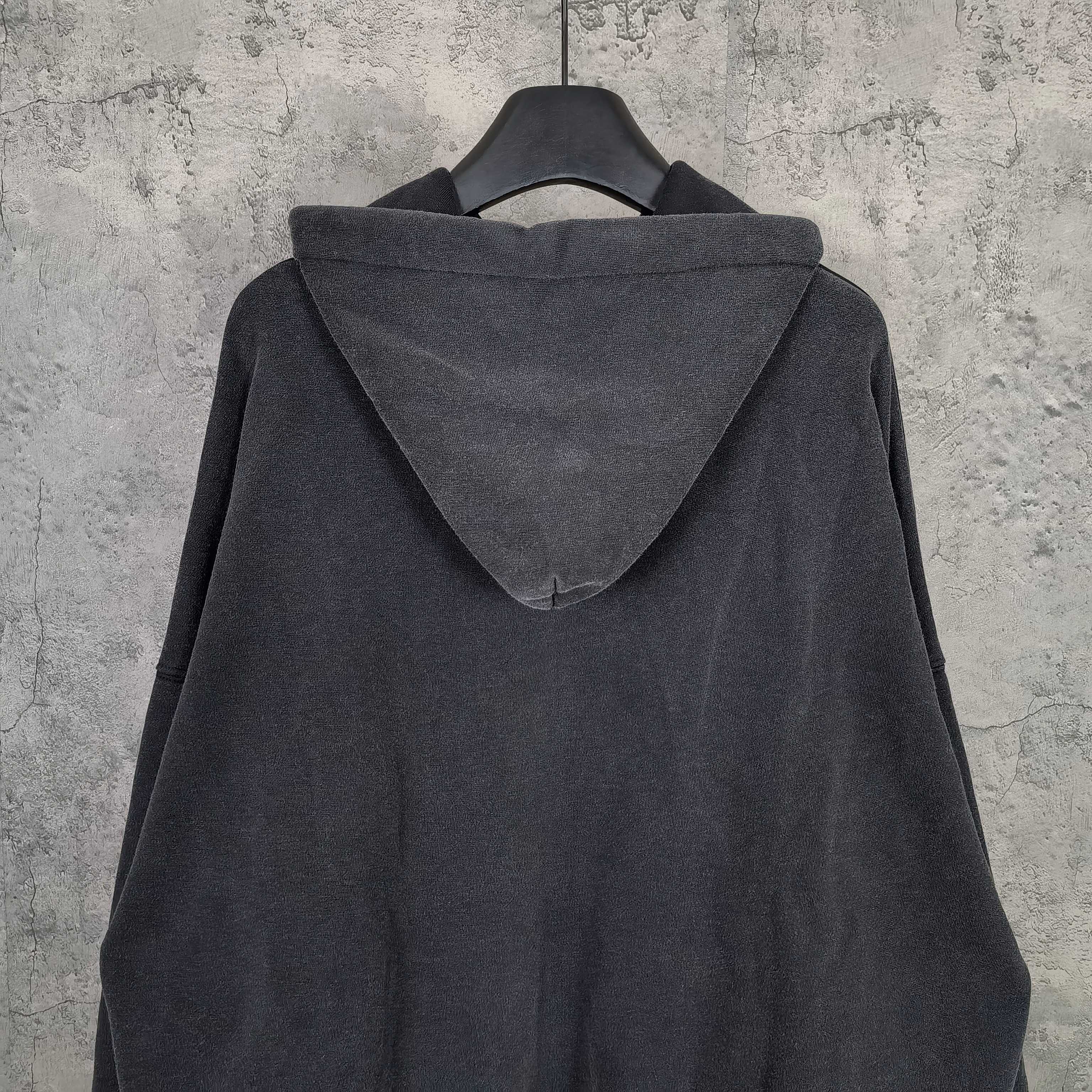 Balenciaga long-sleeve hoodie, dark back view with roomy hood and stitched seams