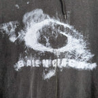 Balenciaga hoodie logo detail in distressed white print on dark fabric