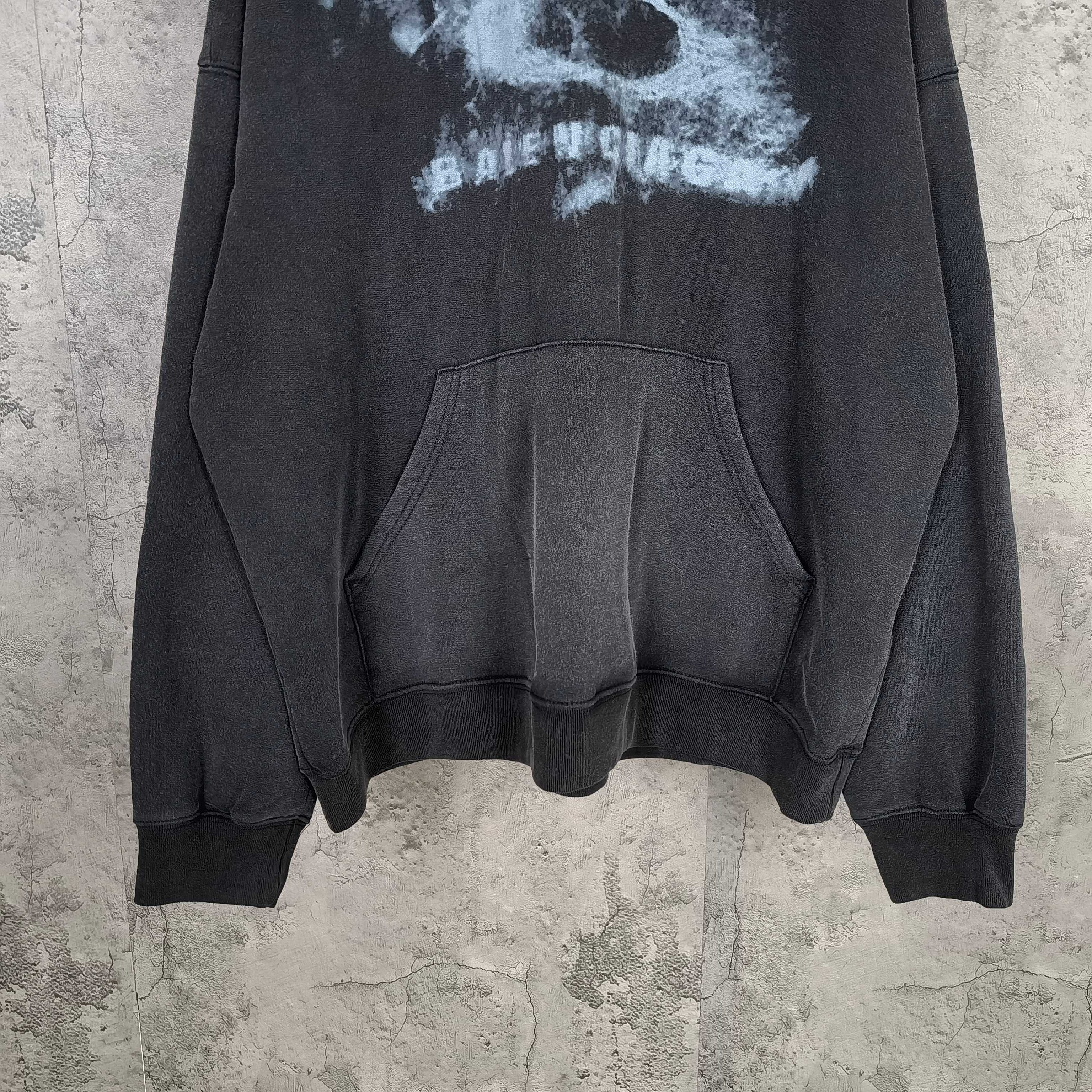 Balenciaga dark hoodie front with kangaroo pocket and ribbed hem and cuffs